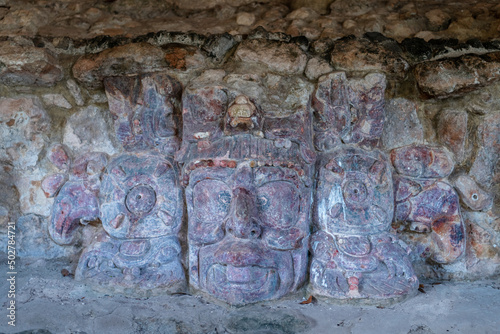 Stucco mask of the mayan Sun God, Kinich Ahau, in the temple of the masks - ancient city Edzna, Campeche, Mexico photo