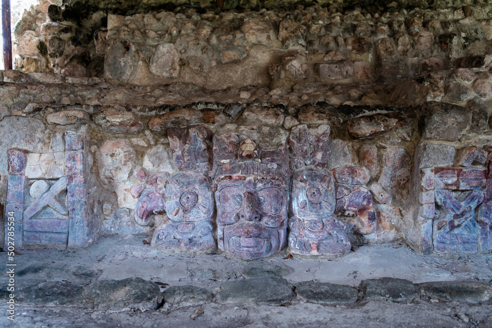 Stucco mask of the mayan Sun God, Kinich Ahau, in the temple of the masks - ancient city Edzna, Campeche, Mexico