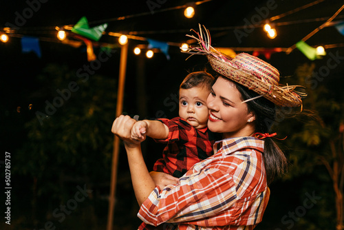 Bild auf Leinwand Portrait of mother and baby son during the typical Brazilian Festa Junina