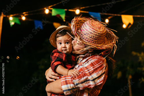 Portrait of mother and baby son during the typical Brazilian Festa Junina photo