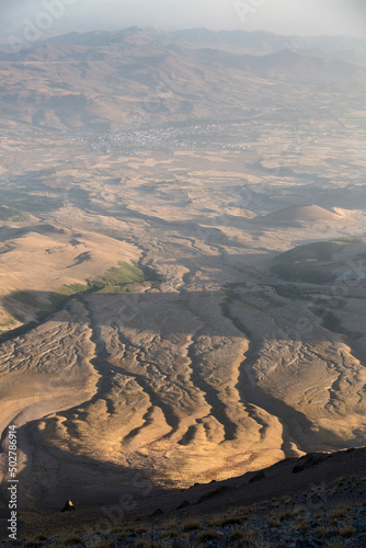 Panorama view from the Mount Ergies at the valley and the bed of dried up rivers during sunset, Kayseri, Turkey