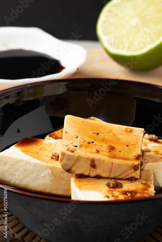 Japanese tofu with soy sauce. Selective focus.
