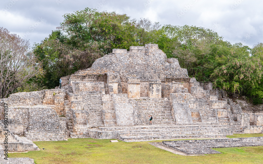 Tourists exploring the ruins of ancient mayan city Edzna - famous archaeological site near Campeche, Yucatan Peninsula, Mexico