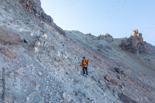 Girl tourist climbing Mount Ergies, large stratovolcano surrounded by many monogenetic vents and lava domes