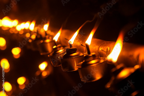 Malay tradition kerosene oil lamp or pelita in selective focus during Hari Raya Aidilfitri celebration. photo