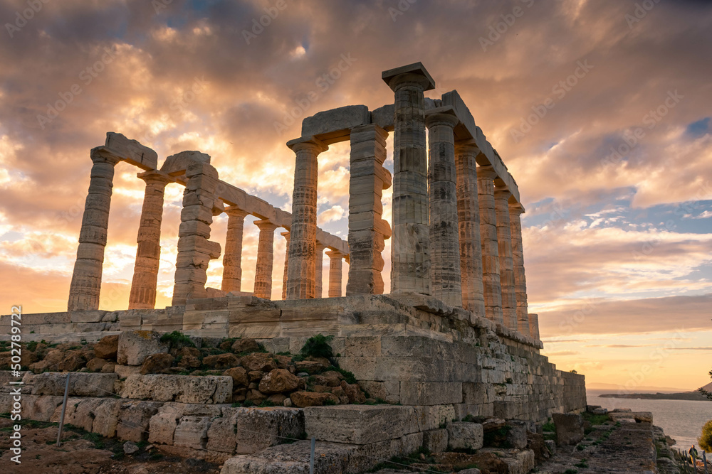 The Temple of Poseidon at Cape Sounion at sunset, over the Aegean Sea, Greece