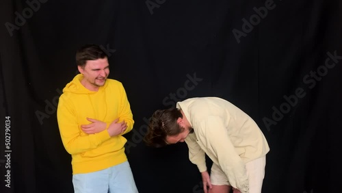 Two dudes laughing uncontrollably, guys can't stop their funny laughter 
 photo