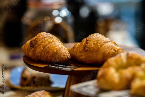 Close-Up of croissants and danish pastries for sale in a cafe
