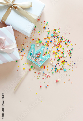 Birthday party background with gift and lollipops. Copy space.