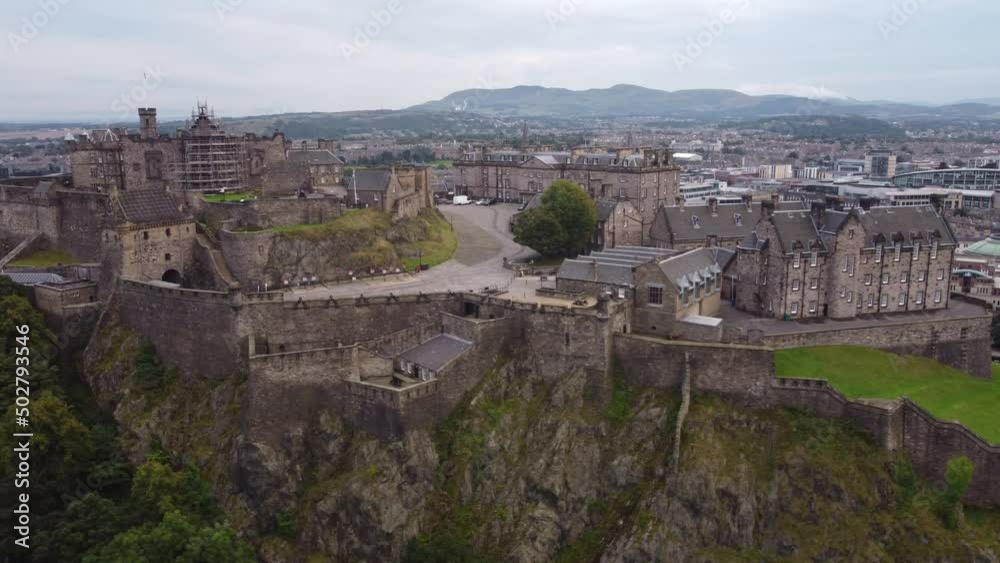 Drone view of the majestic Edinburgh Castle built on a rock. Drone view of the majestic Edinburgh Castle built on a rock.