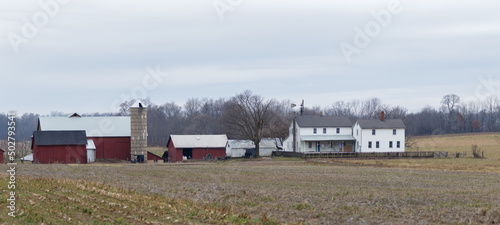 Amish Farm and Homestead and an Unplowed Cornfield with Woods in the background in Early Winter | Holmes County, Ohio