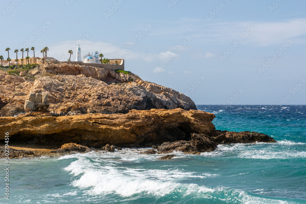 Rocky coast of Koumbara beach located on Ios Island. Cyclades, Greece