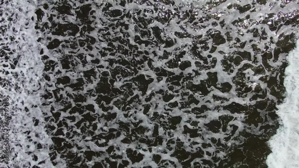 Aerial View Hovering Above White Beach Waves Crashing On Shore In Secluded Beach. Aerial View Hovering Above White Beach Waves Crashing On Shore In Secluded Beach.