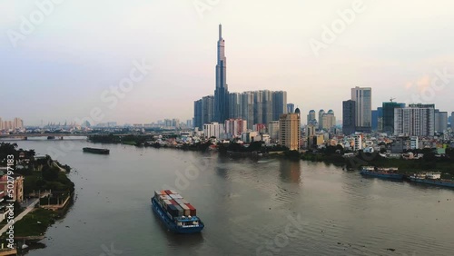 Drone hyperlapse over the river to Landmark 81, Ho Chi Minh City, Vietnam photo