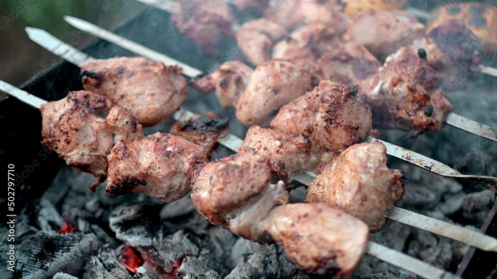 Fried meat grill food street kitchen. Food outside. Shish kebabs or barbecue shashlik on charcoal bbq food festival. Skewer grill cooking close up. Prepared meat grilled delicious grill barbecue party Fried meat grill food street kitchen. Food outside. Shish kebabs or barbecue shashlik on charcoal bbq food festival. Skewer grill cooking close up. Prepared meat grilled delicious grill barbecue party