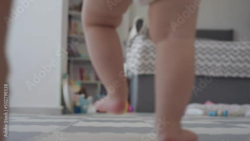 baby first steps with mom bottom view legs