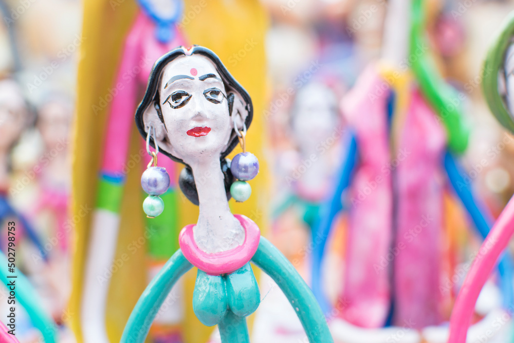 Colorful dolls made of clay, handicrafts on display during the Handicraft Fair in Kolkata , earlier Calcutta, West Bengal, India. It is the biggest handicrafts fair in Asia.