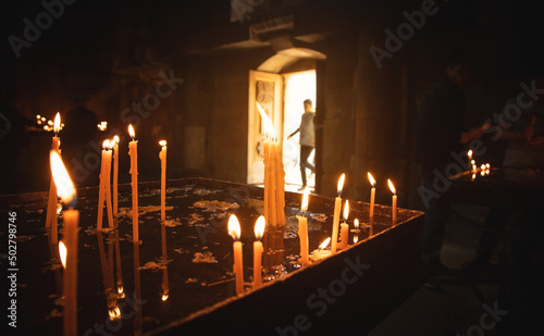 Burning candles in a church.