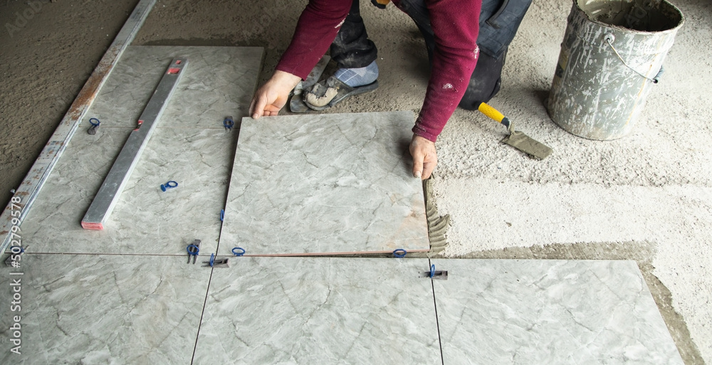 Laying floor ceramic tile. Renovating the floor Laying floor ceramic tile. Renovating the floor