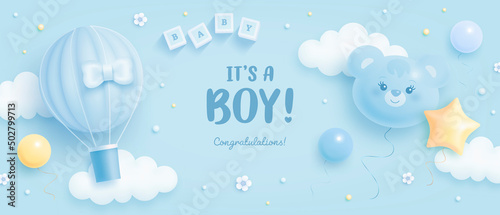 Baby shower horizontal banner with cartoon bear head, hot air balloon, helium balloons and clouds on blue background. It's a boy. Vector illustration