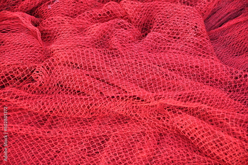 Fisher net close up. Colourfoul Fisher net close-up and details. Red fishing Nets Textured Background