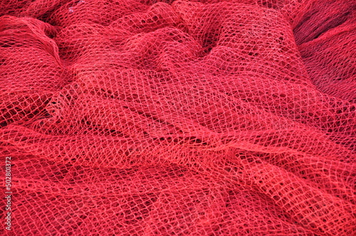 Fisher net close up. Colourfoul Fisher net close-up and details. Red fishing Nets Textured Background
