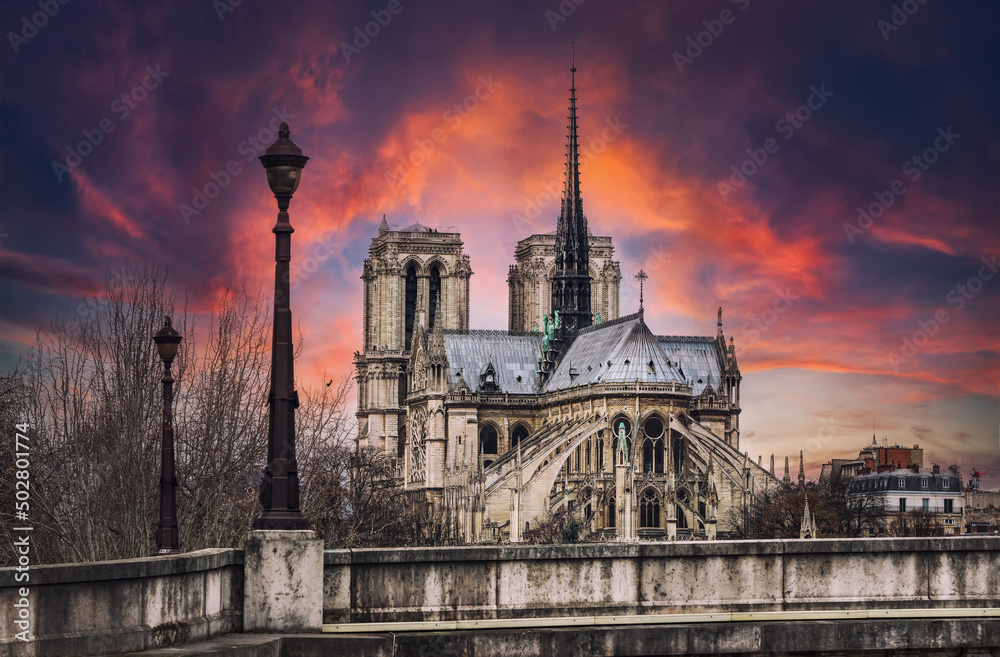 Sunset over the Notre-Dame Cathedral in Paris - Fance Sunset over the Notre-Dame Cathedral in Paris - Fance