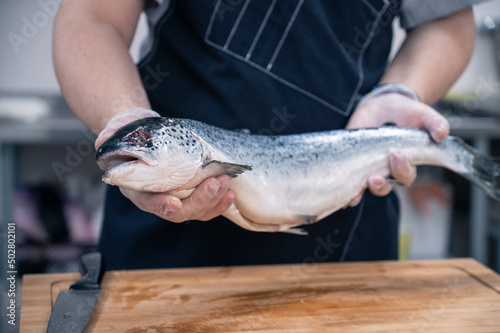 Chef with a salmon fish at ...