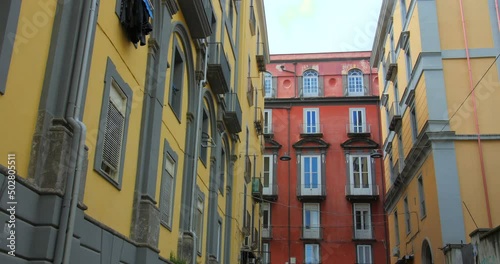 Low angle shot of historical architecture and buildings along the historic center in Naples, Italy at daytime. 4K. photo