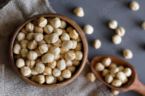 in a wooden bowl with peeled and roasted hazelnuts