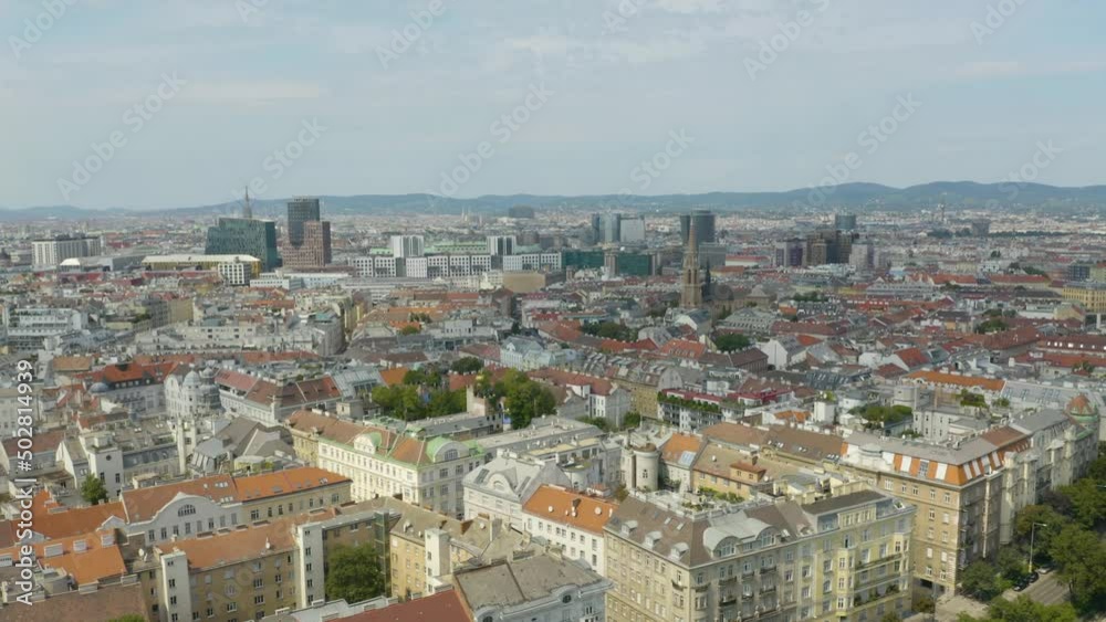 Aerial view of Vienna in the rays of the setting sun. Heldenplatz, Rathaus, Volksgarden and university of Vienna skyline aerial shot. Cathedrals and cityscape City of Vienna, Austria. Aerial view of Vienna in the rays of the setting sun. Heldenplatz, Rathaus, Volksgarden and university of Vienna skyline aerial shot. Cathedrals and cityscape City of Vienna, Austria.