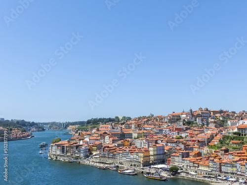 Porto, Portugal. View from Porto to Vila Nova de Gaia. Douro river and ancient historic buildings. Sunny day, blue clear skies.