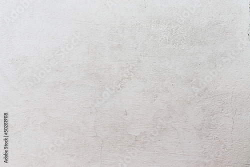 Plaster on a gray wall covered with chalk. The texture of the whitewashed plaster is close-up.