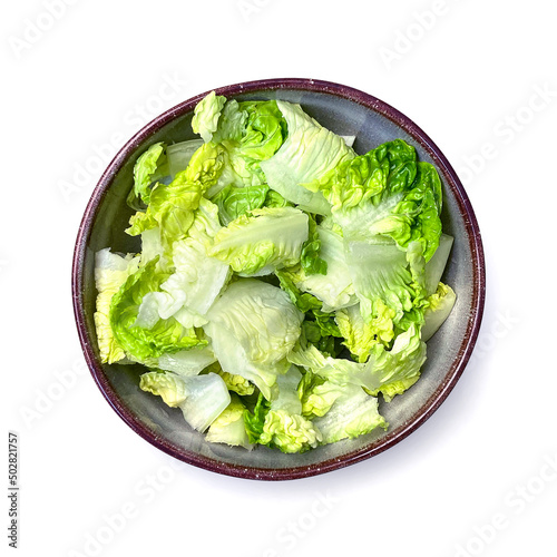 Green salad in bowl on white background