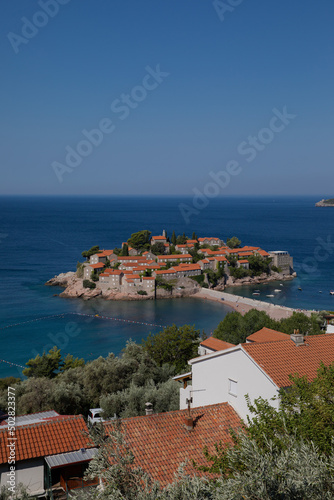 Sveti Stefan Island on a summer sunny day. Hot summer morning. Rest by the sea. The best holiday. Budva, Montenegro.