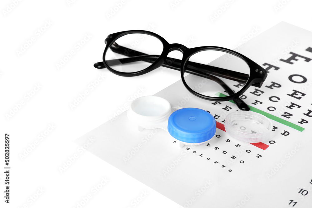 Case with contact lenses, glasses and eye chart test on white background Case with contact lenses, glasses and eye chart test on white background