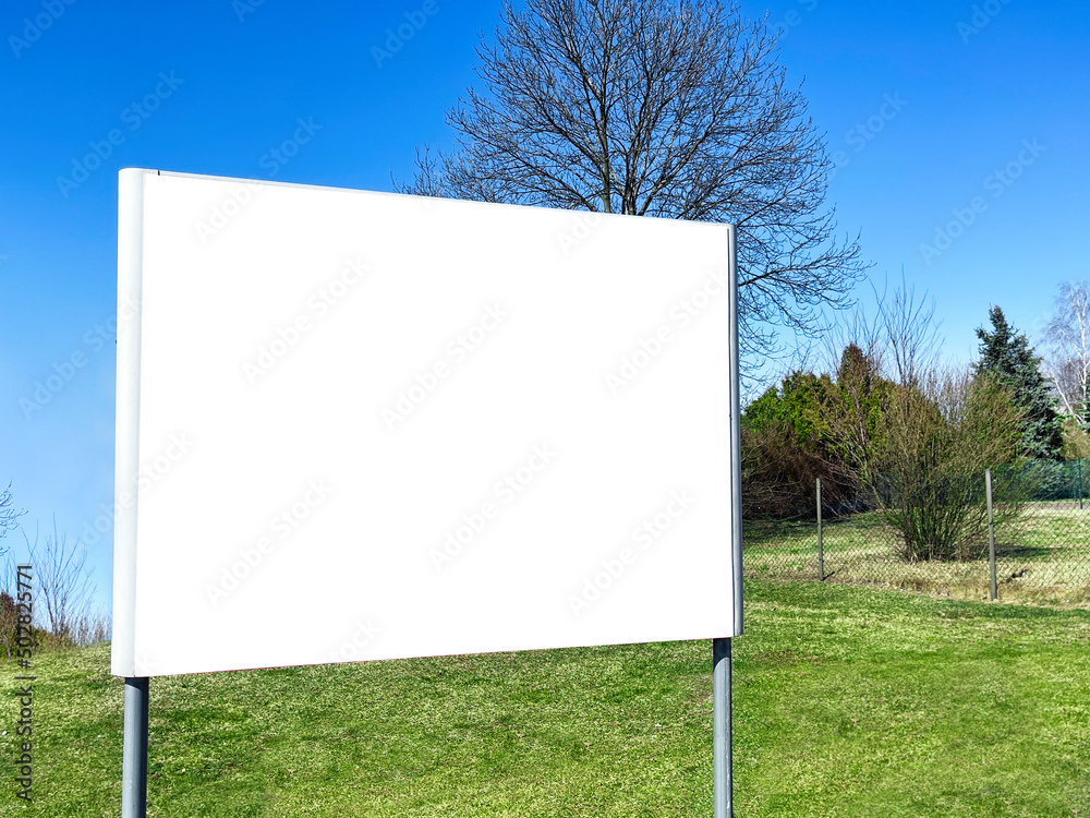 White blank signboard outdoors on sunny day. Mockup for design White blank signboard outdoors on sunny day. Mockup for design