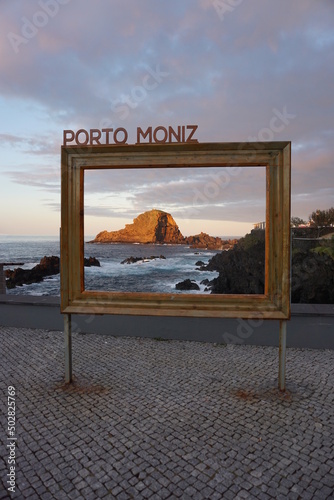 View through a picture frame at Porto Moniz to the rocky mountain on Ilheu Mole and the Atlantic ocean. Madeira, Portugal, Europe photo