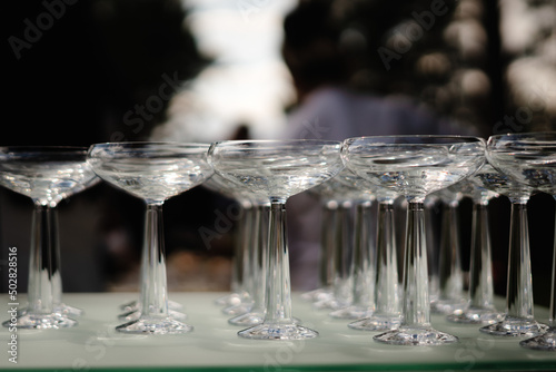 row set of empty wineglasses in restaurant bar