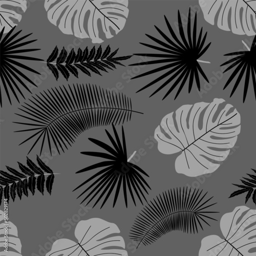 Abstract monochrome background from leaves. Beautiful seamless paper art illustration with tropical palm leaves background. Leaf pattern. Natural flower pattern.