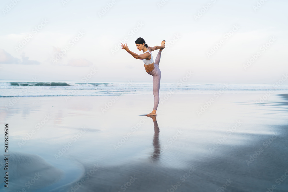 Young female in tracksuit training body flexibility for feeling vitality wellness and recreate on hatha workout, Caucaisan fit girl in sportswear practice mindfulness and concentration on leisure Young female in tracksuit training body flexibility for feeling vitality wellness and recreate on hatha workout, Caucaisan fit girl in sportswear practice mindfulness and concentration on leisure