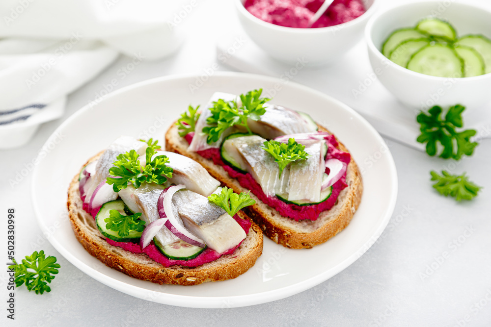 Sandwiches, toasts with salted herring and beetroot pate Sandwiches, toasts with salted herring and beetroot pate