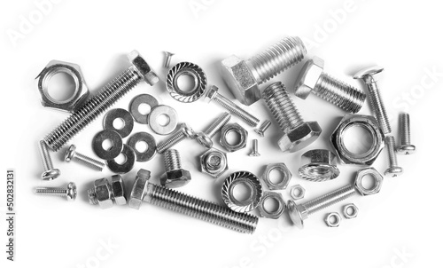 фотографія Different metal bolts and nuts on white background, top view