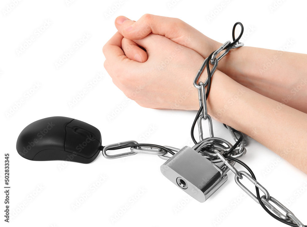 Woman chained to computer mouse on white background, closeup. Internet addiction Woman chained to computer mouse on white background, closeup. Internet addiction