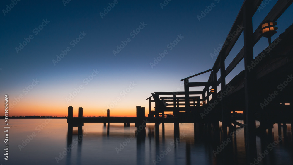Blue orange sunset at the dock on Lake Dora in Mount Dora, Florida