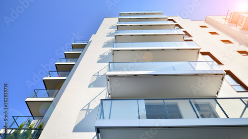 Modern luxury residential flat. Modern apartment building on a sunny day. Apartment building with a blue sky. Facade of a modern apartment building.