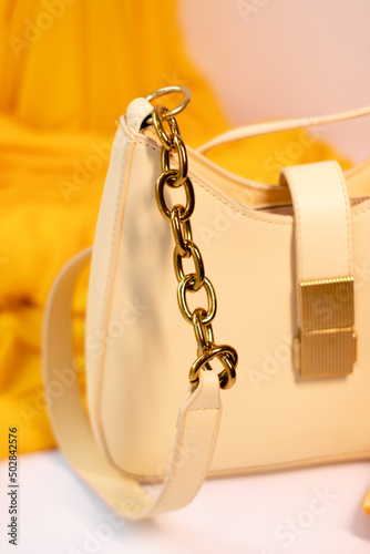 fashion photo of purse. beige woman handbag isolated on white background. Product composition photography