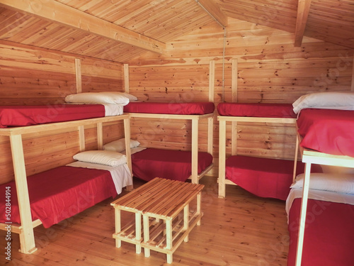 Interior of a log cabin with bunk beds
