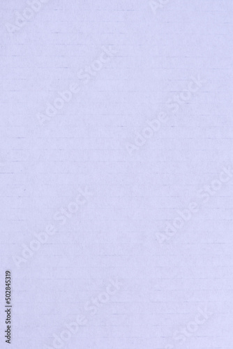 Textural background of white striped cardboard. Texture of white packaging cardboard close-up. Recyclable natural white cardboard with textured stripes.