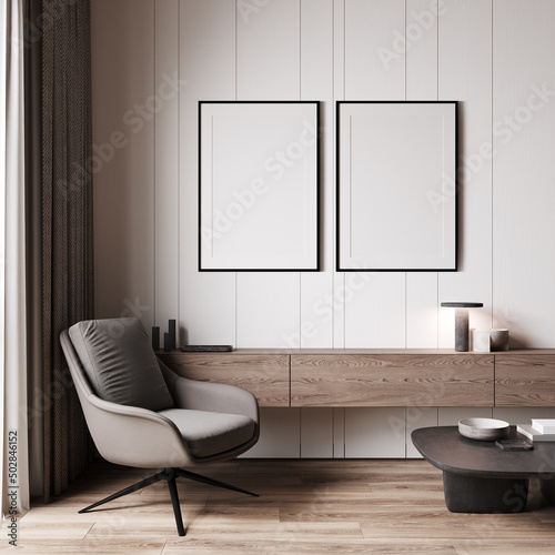 Living room with mock-up poster frames, armchair and home decoration, 3d illustration. © Liliia
